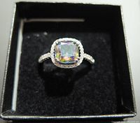 Front view of the silver fashion ring showing cushion cut multicolor gemstone in ornate setting.