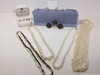 Overview of entire lot showing necklaces, earrings, pendants, brooch and rings