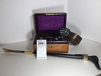 Lot of 7 items including antique wooden jewelry box, leather belt with turquoise buckle, sterling pendant, leather card holder, Mercedes Benz key chain, shoehorn with resin duck head
