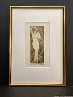 Full view of the framed 'Venus' print showing gold frame and white matting