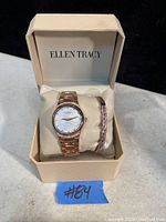 Rose gold-tone Ellen Tracy wristwatch and bracelet set in original cream-colored Ellen Tracy box with cushioned support.