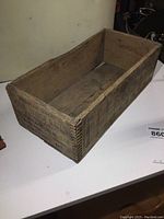 Wooden crate showing overall condition and structure including dovetail joints.