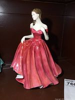Front view of Royal Doulton Jasmine porcelain figurine, 8.5 inches tall, in red flowing dress