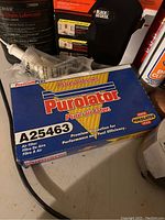 Purolator air filter box surrounded by other products