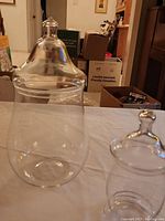 Photo showing the larger glass jar without its lid placed on the table beside it.