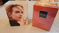 Image of the sealed perfume bottle packaging with model image.