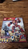 Front of the LEGO Marvel Super Heroes Avengers: Infinity War Hulkbuster vs. Wakandan Battle box showing set details and lego minifigures.