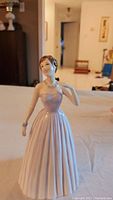 Front view of porcelain Royal Doulton Samantha figurine in lilac strapless gown with necklace and bracelet.