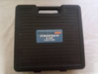 Closed black plastic carrying case with Pittsburgh Automotive label indicating A/C manifold gauge set for R-134A.