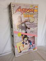 Full front view of unopened Agassi Street Tennis Set box showing product artwork and branding with tennis player image and set details.