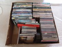 Wide angle of the entire media lot in a box showing both DVDs and CDs.