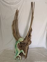 Overall view of tall dried wood branch with metal lizard attached, showing natural wood grain and branch extensions.