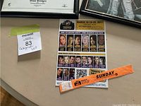 Photo showing a convention wristband labeled 'Sunday' and a Fan Expo Toronto 2011 flyer featuring guest actor headshots from sci-fi series.