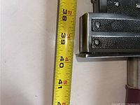 Measuring tape showing total blade and handle length approaching 52 inches total.