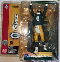 Brett Favre Green Bay Packers Series 7 NFL figure new in box, showing figure with arms raised and original packaging visible.