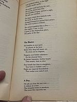Close-up photo of a page from the Tolkien journal showing poems titled 'The Master' and 'A Day' with creamy paper and serif font.