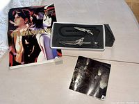 Set of Final Fantasy VIII jewelry and collectibles with original packaging, complete except missing necklace.