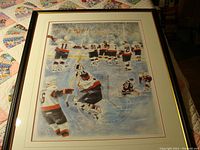 Framed hockey print showing Ottawa Senators players celebrating on ice with visible numbering and signature.