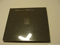 Front view of the black hardcover Canada Post Millennium Collection 2000 stamp album, showing title.