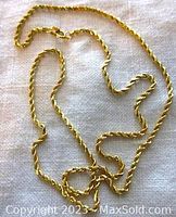 Overview of the entire chain laid out on a light fabric background