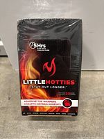 Sealed box of Little Hotties adhesive toe warmers with flame design on front, indicating up to 5 hours of heat and 30 pairs in box.