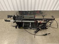 Folded Synergy electric scooter frame showing main structure, wiring and mounting points.