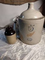 Photo of the two crockery items showing the large stoneware jug and smaller jar side by side.