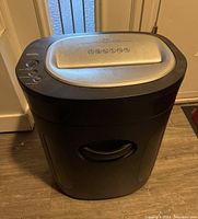 Front view of the black Royal paper shredder showing the top silver-gray shredding slot and black base.