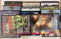 Partial view of DVD cases including Reefer Madness and Ever After in front with other titles visible behind