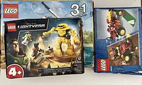 Photo showing all three Lego boxes stacked: Lightyear 76830, Creator 3-in-1 Adventure Vehicles 31037, and Scorpion Buggy 6602 with visible logos and artwork.