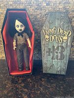 Front view of "Roxie" doll taken out of box showing clothing and facial details.