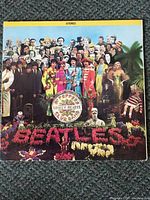 Front cover of Sgt. Pepper's Lonely Hearts Club Band album showing colorful collage and band photo