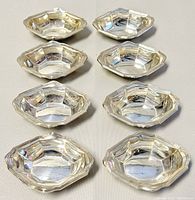 Overhead view of all eight salt cellars arranged in two columns of four.