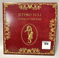 Front cover of the Jethro Tull album 'Living in the Past' showing the red and gold artwork and title.