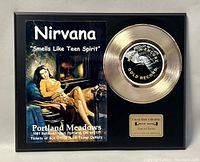 Front of gold record display plaque featuring Nirvana poster image and gold record