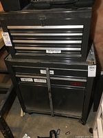 Front view of stacked top chest and bottom cabinet, showing overall appearance