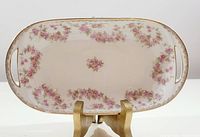Top-down view of rectangular Noritake dish showing floral pattern and gold trim.