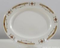 Oval Sampson Bridgwood & Sons serving platter with detailed gold and maroon border decorated with urns and garlands
