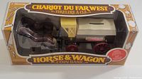 Front view of the unopened vintage Home Hardware Horse & Wagon coin bank in original box detailing the horse pulling wagon model.