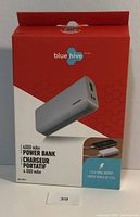 Red and white Bluehive retail box with image of white power bank, listing 4000 mAh capacity and 1.8 A output.