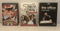 Front covers of the three DVD sets: The Best of Benny Hill, Fawlty Towers Complete Collection Remastered, and The Office complete series 1 & 2 with special.