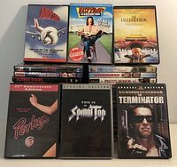 Front view showing a selection of DVD covers including Airplane!, Fast Times at Ridgemont High, The Last Emperor, Porkys 25th Anniversary Edition, This Is Spinal Tap Special Edition, and The Terminator Special Edition.