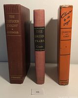 Photo showing the spines of three vintage books: The Virtuous Knight (1931), The Green Years (1945), Cheaper by the Dozen (1949).