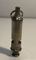 Front view of the silver metal whistle showing the Boy Scouts of Canada emblem with 'CANADA' engraving on the body.