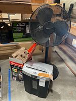 Honeywell fan with Fellowes shredder and Honeywell ceramic heater boxed and unboxed, arranged together