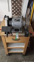 Front view of grinder mounted on cabinet