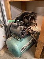 Full view of compressor showing motor, pump head and tank