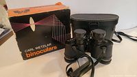 Carl Wetzlar binoculars in original box and black leather carrying case.