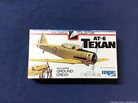 Sealed MPC AT-6 Texan model airplane kit box with ground crew figures included.