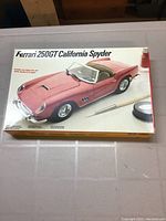 Closed box of Ferrari 250GT California Spyder model car kit showing the assembled car image and box details.